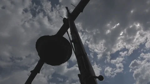 Rifle and German helmet of the Second World War against a blue sky with clouds Stock Footage 89503801