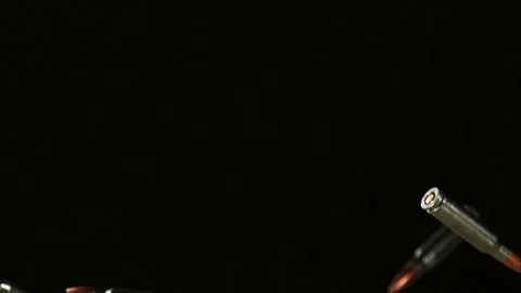 Rifle bullets falling through a black void in slow motion Stock Footage 326624794