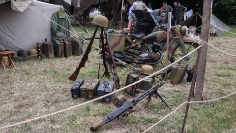 Rifles, machine gun, ammunition and motorbike from WWII Stock Footage 244423170