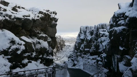 Rift valley caused by the separation of 2 tectonic plates between rocky cliffs Stock Footage 93469809