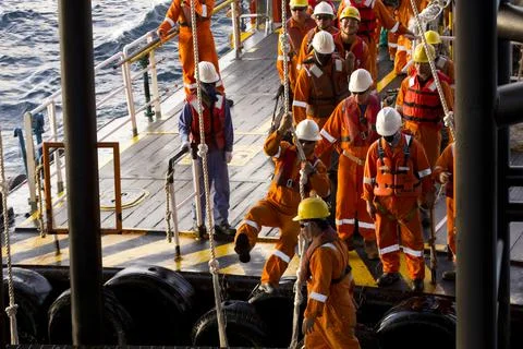 Rig workers are transported by vessel to offshore rigs Stock Photos