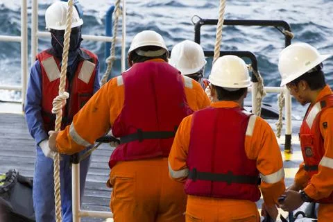 Rig workers are transported by vessel to offshore rigs Stock Photos