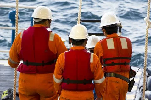 Rig workers are transported by vessel to offshore rigs Stock Photos