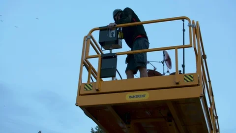 Riga, August 19: drummer with drum kit going up above the crowd on construction 動画素材 93989100