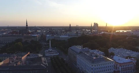 Riga city and evening time sunset Old town Riga Drone flight over Roads and Stock Footage 84263264