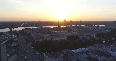 Riga city and evening time sunset Old town Riga Drone flight over Roads and Stock Footage 84264348