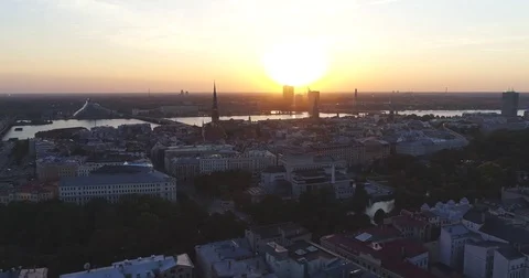 Riga city and evening time sunset Old town Riga Drone flight over Roads and Video stock 84264772