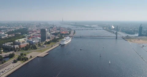 Riga city cable-stayed bridge Dugava river and il city Drone Flight yacht ferry Stock Footage 87805542