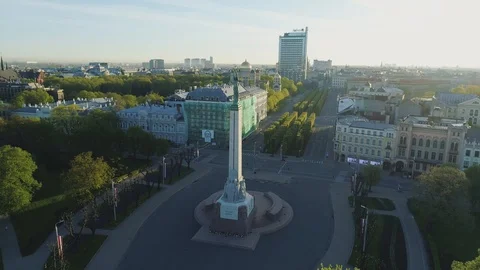 Riga city sunset in Old Down Town near Milda monument Drone flight Stock Footage 91285121