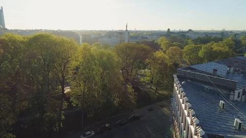 Riga city sunset in Old Down Town near Milda monument Drone flight Stock Footage 91285753