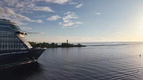 Riga, Latvia - May 22, 2026: Huge Cruise Ship Passing by Small Pier Stock Footage 335718722