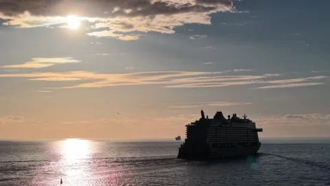 Riga, Latvia - May 22, 2026: Cruise Ship Departing into Sunset Stock Footage 335718756