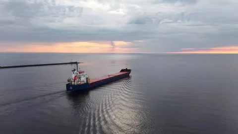 Riga, Latvia - May 3, 2026: Cargo Ship Passing Riga Harbor Piers Stock Footage 334062861