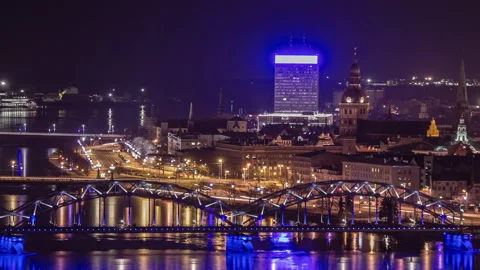 Riga, Latvia. Night time-lapse of traffic in city with bridge in Stock Footage 217441152