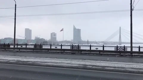 Riga, Latvia, A train crossing a bridge over a road Stock Footage 134417470