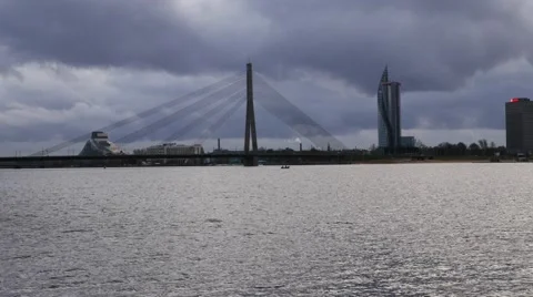 Riga, Latvia. The view to cable stayed bridge and Sun Stone from Kipsala island Stock Footage 60605317