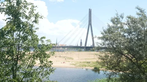 Riga, Latvia, view throught the trees of Vanšu bridge Stock Footage 111982469