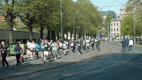 Riga Marathon 2023, the crowd of runners on Zigfrida Annas Meirovica blv. Stock Footage 240538815
