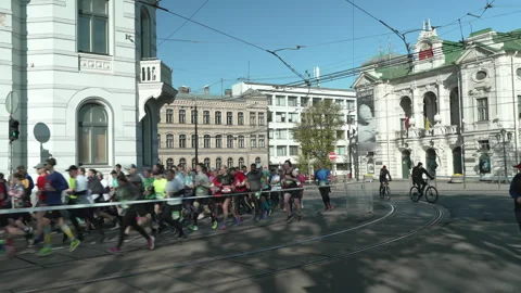 Riga Marathon 2023, runners on corner Valdemara str. Stock Footage 240538803