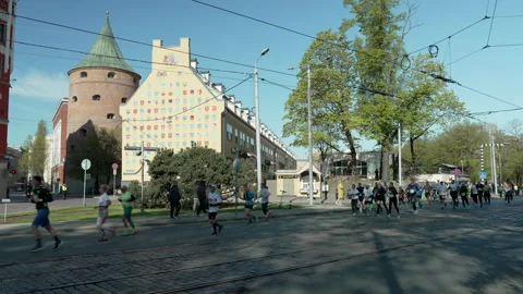 Riga Marathon 2023, runners passing War Museum. Stock Footage 240538874