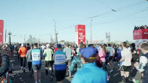 Riga Marathon 2023, runners run thru start line Stock Footage 240538520