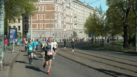 Riga Marathon 2023, runners run on Zigfrida Annas Meirovica blv. Stock Footage 240538593