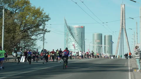 Riga Marathon 2023, runners run on Vansu Bridge Stock Footage 240538707
