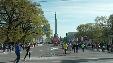 Riga Marathon 2023, runners run to Freedom Monument. Stock Footage 240538941
