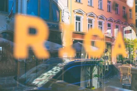 Riga in the reflection of shop windows Stock Photos