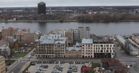 Riga riverside rooftops and parking lot facing the far bank, overcast. Stock Footage 320169931