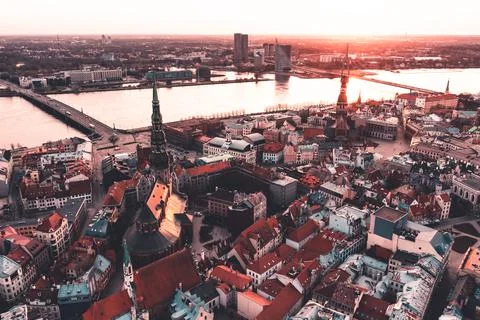 RIga rooftop view panorama at sunset with urban architectures and Daugava Riv 库存照片