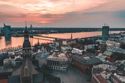 RIga rooftop view panorama at sunset with urban architectures and Daugava Riv 库存照片