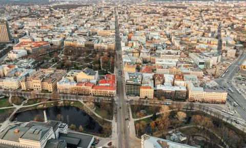 RIga rooftop view panorama at sunset with urban architectures and Daugava Riv 库存照片