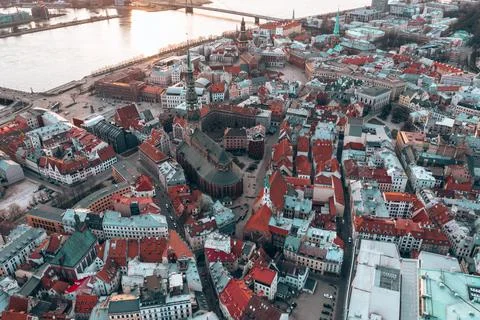 RIga rooftop view panorama at sunset with urban architectures and Daugava Riv 库存照片