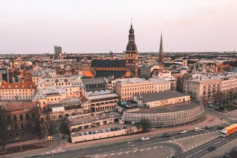 RIga rooftop view panorama at sunset with urban architectures and Daugava Riv 库存照片