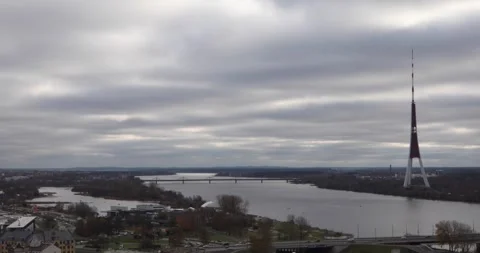 Riga TV Tower over the Daugava River under heavy overcast skies. Stock Footage 320169950