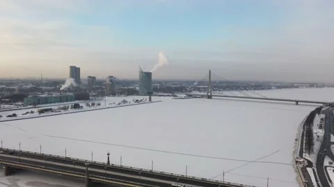 Riga,Aerial 4K video from drone on Stone and cable-stayed bridge winter day Stock Footage 148791453