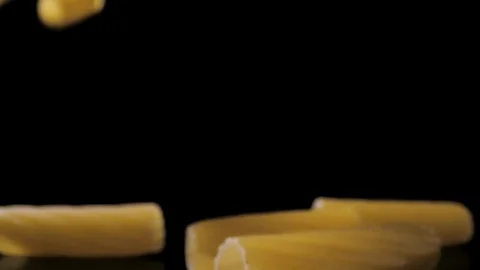 Rigatoni Pasta Falling Down black background, slow motion Stock Footage 112449284