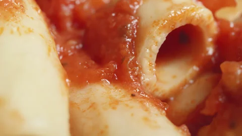 Rigatoni pasta in tomato sauce macro close up presentation slowly rotating .. Stock Footage 344704757