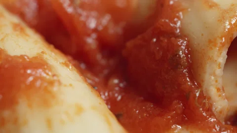 Rigatoni pasta in tomato sauce macro close up presentation slowly rotating .. Stock Footage 344704955