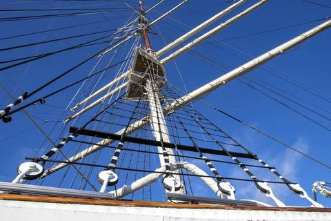 Rigging and mast of a large sailing ship. Ropes and pulleys for tensioning sa Stock Photos