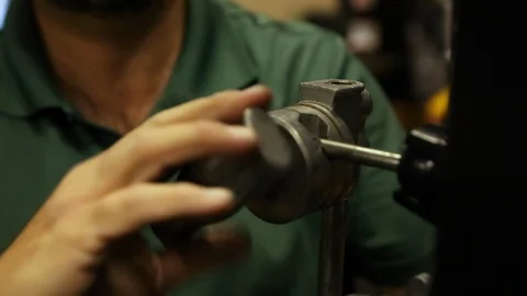 Rigging clamp or elbow being adjusted on TV set by gaffer Stock Footage 125491861