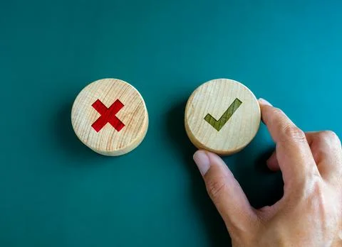 Right and wrong. Close-up green check mark and red X mark icon on round woo.. Stock Photos
