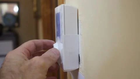 Right angle view of a thermostat in a wall Stock Footage 322026878