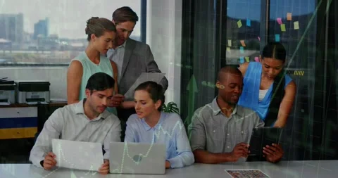 Right colleague tapping tablet and projecting animated charts across laptops for Stock Footage 330195023