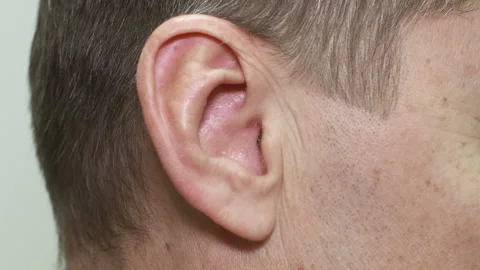 Right ear of middle aged man listening music, problems of human hear, deafness. Stock Footage 231317154