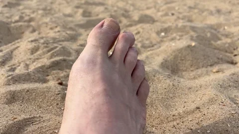 Right foot - relaxing on a beach Stock Footage 313368482