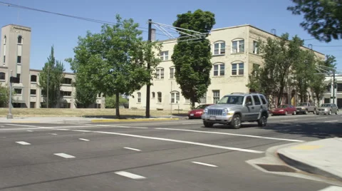 Right Front Three Quarter view of a Driving Plate: Car turns left from NE Couch Stock Footage 59304725