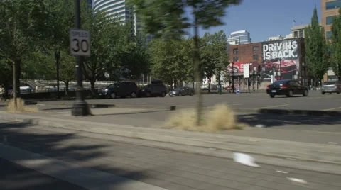 Right Front Three Quarter view of a Driving Plate: Car travels on SW Naito Stock Footage 59305995