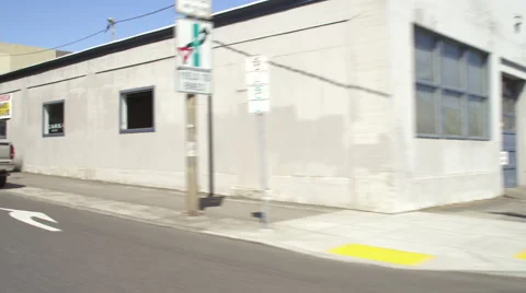 Right Front Three Quarter view of a Driving Plate: Car travels westbound on Stock Footage 59319315